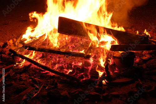 Bonfire with burning boards, large, at night in the dark. For Lag Omer