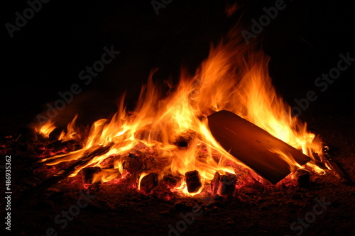 Bonfire with burning boards, large, at night in the dark. For Lag Omer