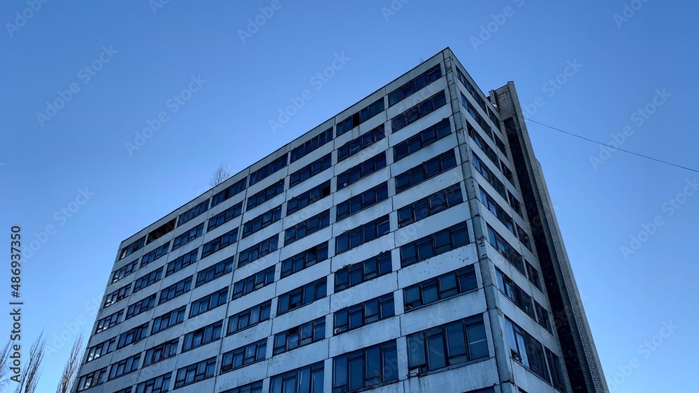 High-rise abandoned office building belonging to an old factory High-rise abandoned office building belonging to an old factory
