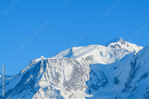 The peaks of the Mont Blanc massif in Europe, France, Rhone Alpes, Savoie, Alps, in winter, on a sunny day.