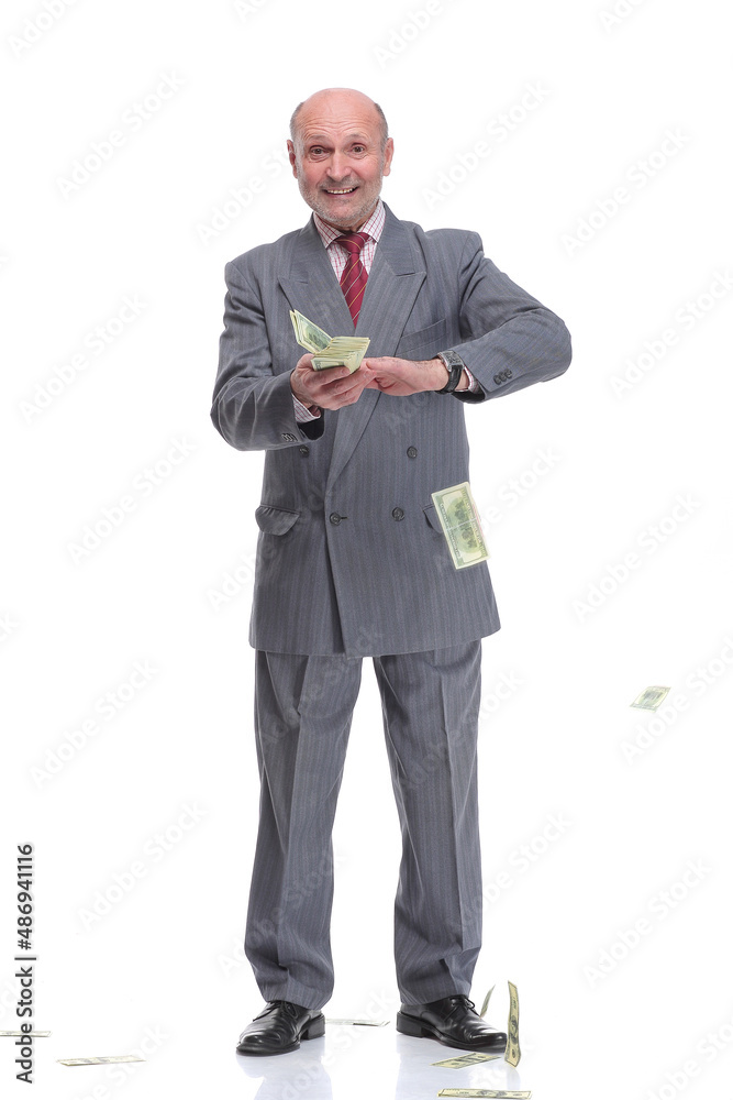 Mature businessman in suit and formal wear throwing in air dollar banknotes Mature businessman in suit and formal wear throwing in air dollar banknotes