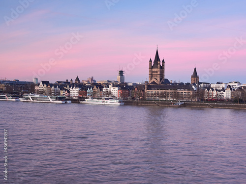Panorama of the old town of Cologne on the banks of the river Rhine at dawn. View of the Fish Market and the Big Church of St. Mark.