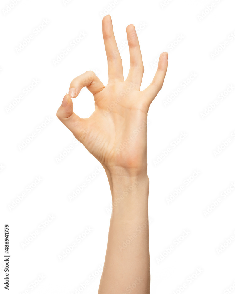 Woman hand show sign ok or okey. Beautiful elegant female hand show gesture finger fine on isolated white