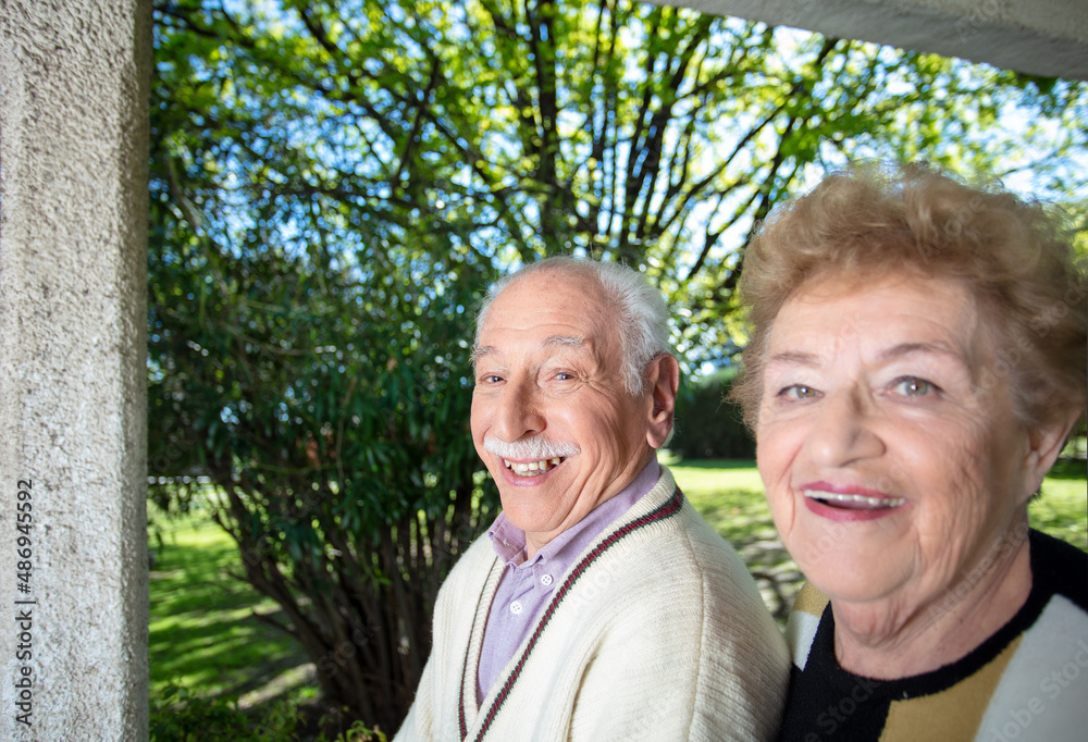 Happy couple of seniors smiling walking outdoor. Retired elderly people living their life at its best. Happy couple of seniors smiling walking outdoor. Retired elderly people living their life at its best.