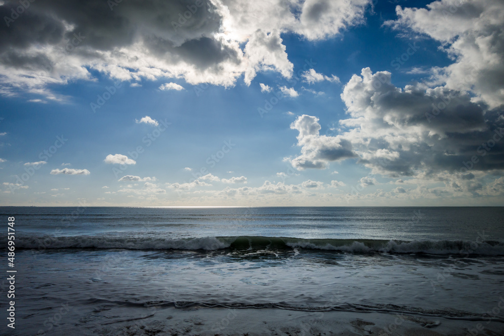 Cloudy seascape view from a beach at sunset Cloudy seascape view from a beach at sunset