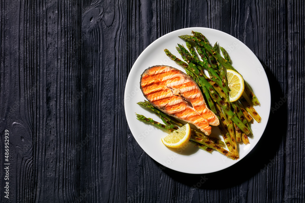 grilled salmon steak with asparagus and lemon