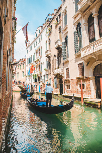 Italy, Venice - May 25, 2019: people at gondola taking tour by canal © phpetrunina14