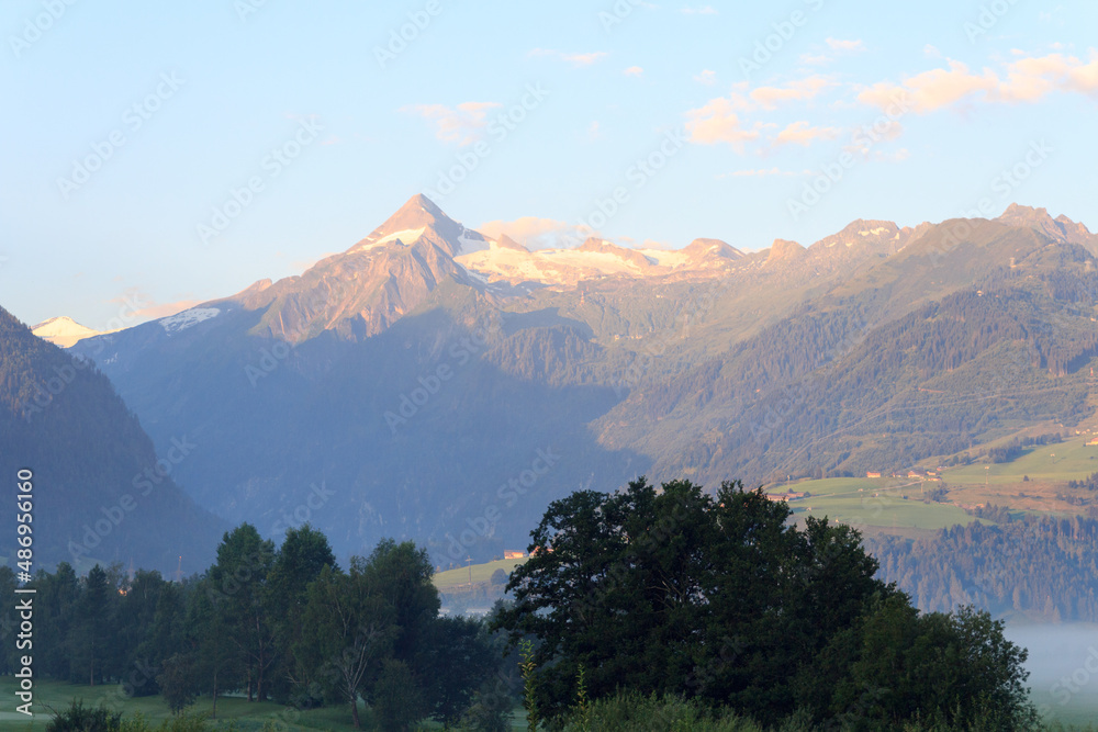 Panorama view with alpine mountains and blue sky in Salzburgerland, Austria