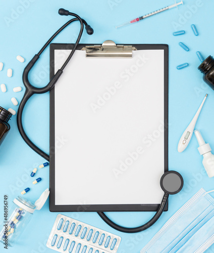 A tablet with a blank page on a blue background. Medical diagnosis or a mock-up of a doctor's prescription.