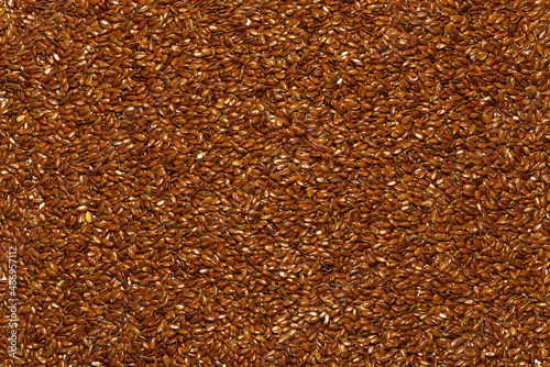 Background of flax seeds all over the field photo