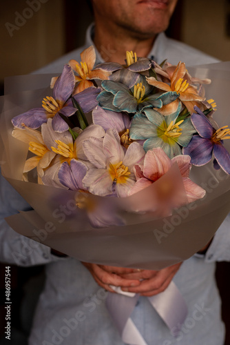 Bouquet of multi-colored tulips on the background