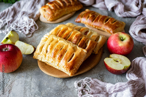 Cuadro en lienzo Puff pastry with apples and cinnamon for breakfast for the family on a gray background