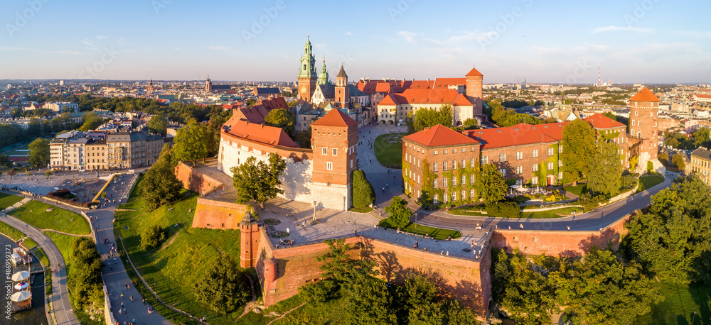 Royal Wawel Cathedral and castle in Krakow, Poland. Aerial panorama in sunset light in summer with a park,  promenade and  walking people - obrazy, fototapety, plakaty 