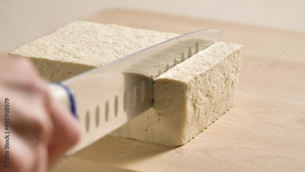 Tofu chunks closeup. Plant based diet. Vegan protein source. Healthy eating. Soybean product Tofu chunks closeup. Plant based diet. Vegan protein source. Healthy eating. Soybean product