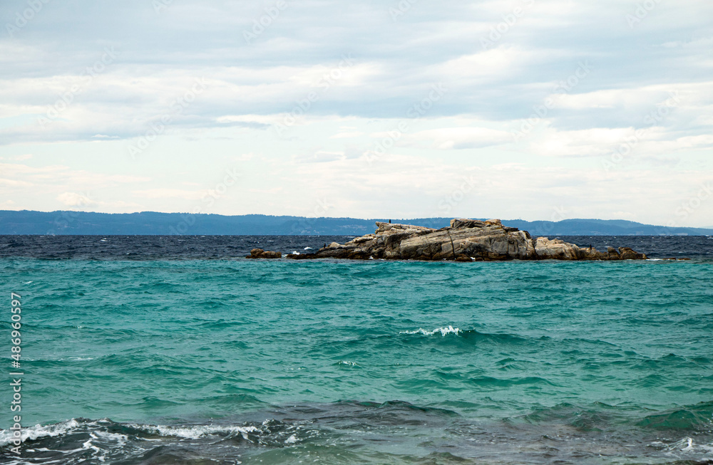 Lonely island in Aegean Sea, the beautiful beach of Kalogria, Greece Lonely island in Aegean Sea, the beautiful beach of Kalogria, Greece