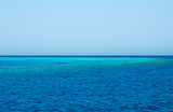 Blue sea water horizon line. Seawater background. Blue sea with little waves texture. Seawater surface texture