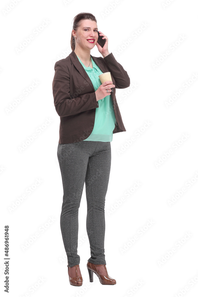 Portrait of a cheerful laughing businesswoman in suit holding take away coffee cup while talking on mobile phone Portrait of a cheerful laughing businesswoman in suit holding take away coffee cup while talking on mobile phone