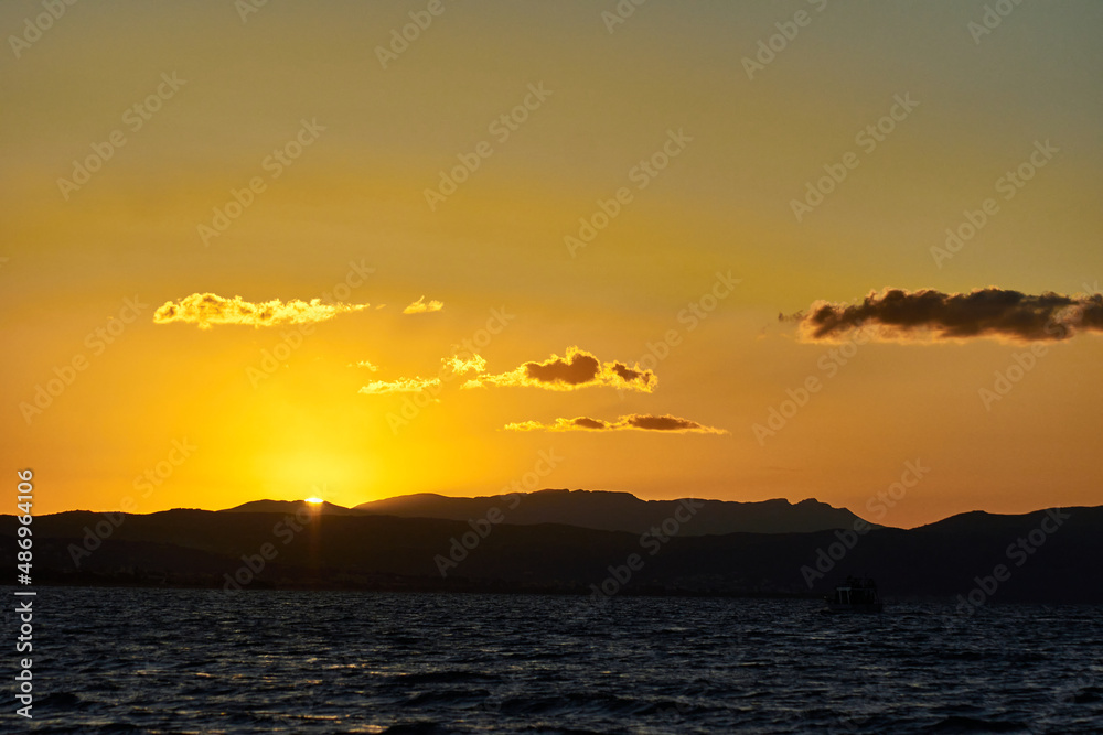 Sunset on the mountainous coast of Crete island