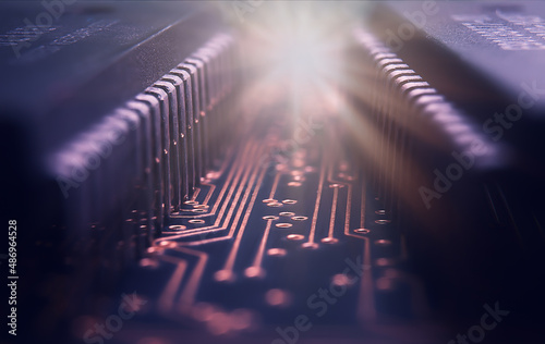 Macrophotograhy  of integraded circuits on Printed Circuit Board with golden pads and wires photo