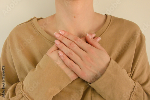 Woman suffering from chest pain photo