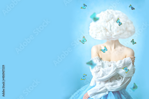 Beautiful girl with cloud head and flying butterflies on a blue background