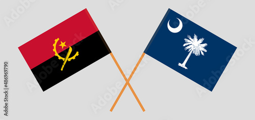 Crossed flags of Angola and The State of South Carolina. Official colors. Correct proportion