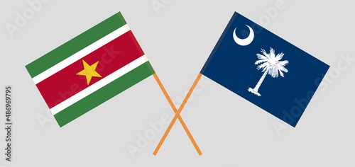 Crossed flags of Suriname and The State of South Carolina. Official colors. Correct proportion