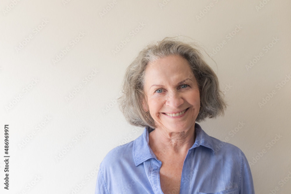 Portrait of smiling older woman with blue eyes (selective focus) Portrait of smiling older woman with blue eyes (selective focus)