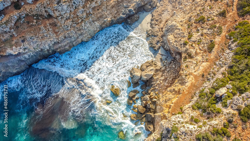 See shore hitting a tiny secret beach - seen from above