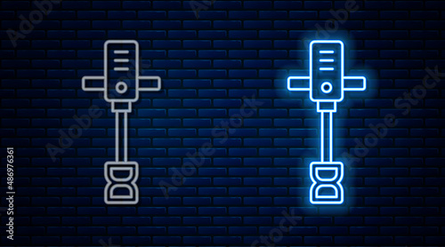 Glowing neon line Electrical hand concrete mixer icon isolated on brick wall background. Handheld electric cement mixer. Vector
