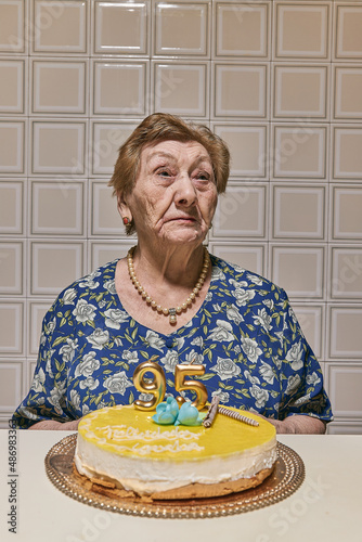 Slika na platnu almost centennial woman, lively and happy celebrating her birthday party