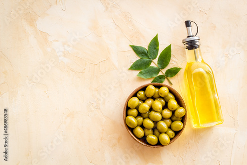Wallpaper Mural Bottle of olive cooking oil with green olives in bowl
