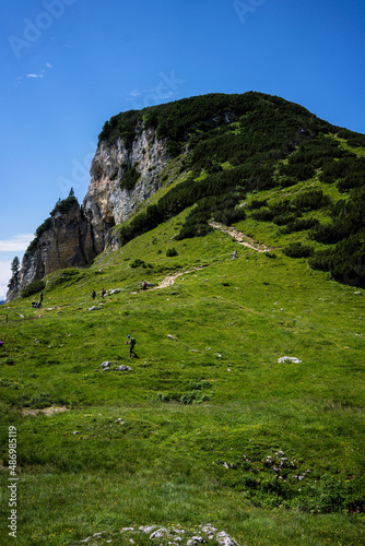 Hikers are on tour at Karwendel Rofan Mountains at Achensee in Austria