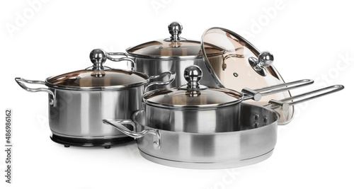 Set of stainless steel cookware on white background