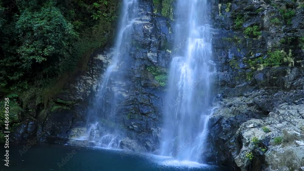 waterfall flowing water from mountain at forest from flat angle video taken at thangsingh waterfall shillong meghalaya india. waterfall flowing water from mountain at forest from flat angle video taken at thangsingh waterfall shillong meghalaya india.