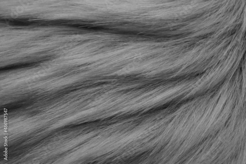Grey faux fur as background, top view