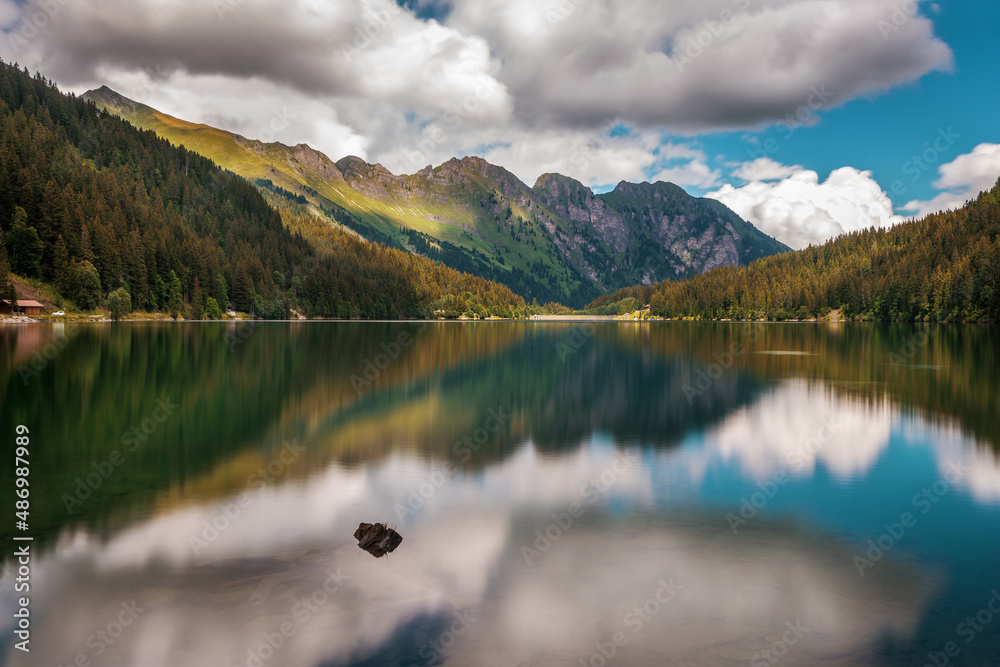 Reflecting mountain lake in switzerland