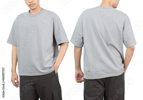 Young man in grey oversize t-shirt mockup front and back used as design template, isolated on white background with clipping path.