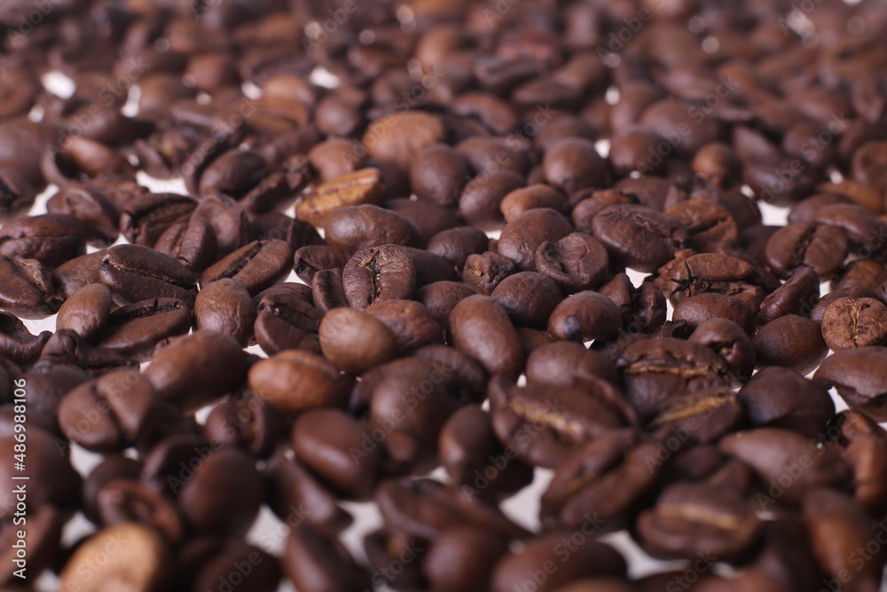 Coffee beans isolated on white background with copyspace for text. Coffee background or texture concept. Coffee beans isolated on white background with copyspace for text. Coffee background or texture concept.