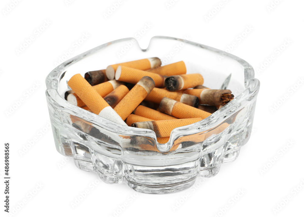 Glass ashtray with cigarette stubs isolated on white Glass ashtray with cigarette stubs isolated on white