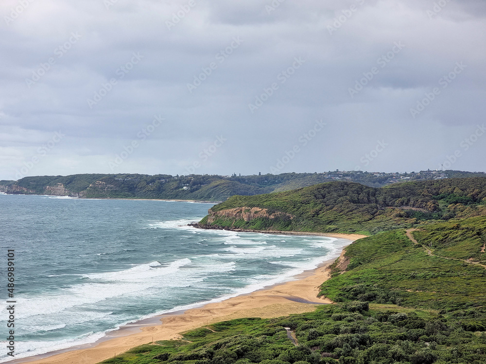 Burwood Beach Newcastle Australia. Seen from the Hickson Street Lookout. Looking over the coastal sand dunes with surf rolling onto the beach