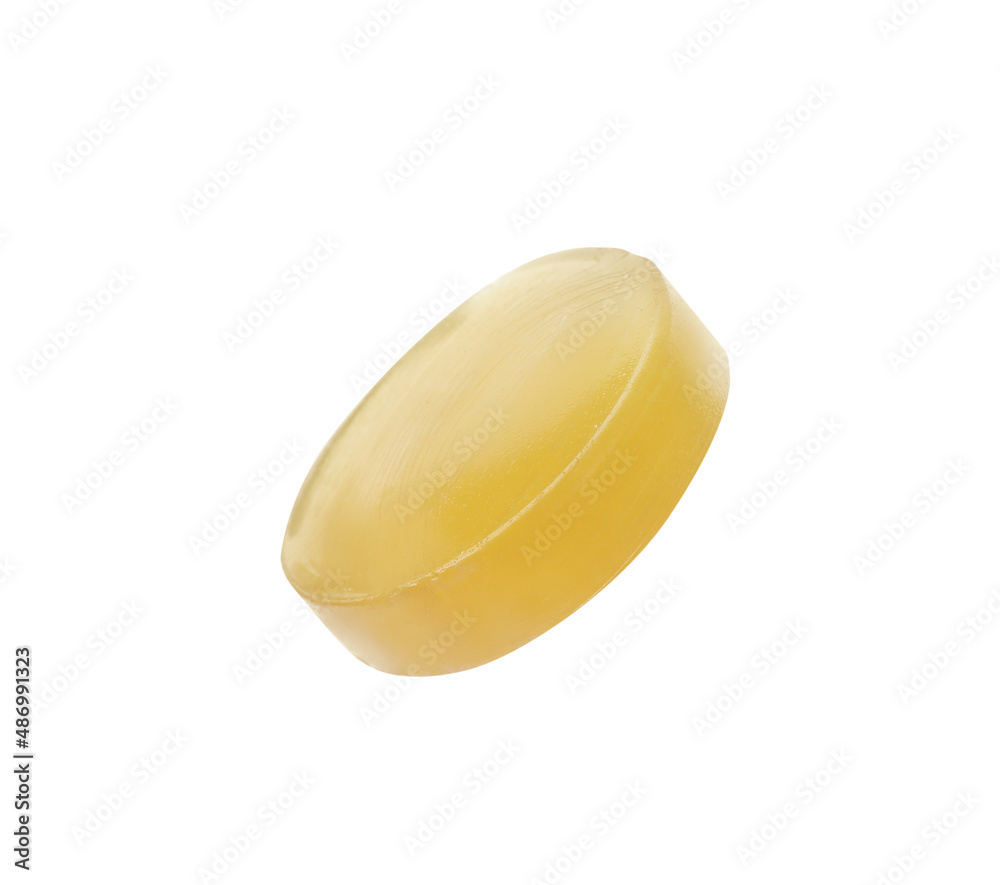 One yellow cough drop isolated on white One yellow cough drop isolated on white