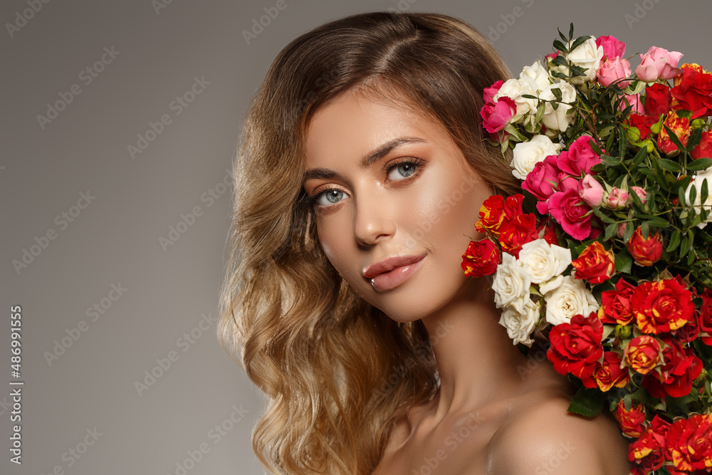 Fashion model with flowers. Spring girl. Woman with a summer bouquet of flowers. Fashion model with flowers. Spring girl. Woman with a summer bouquet of flowers.