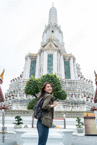 Portrait of Asian attractive woman backpacker travel in beautiful city.