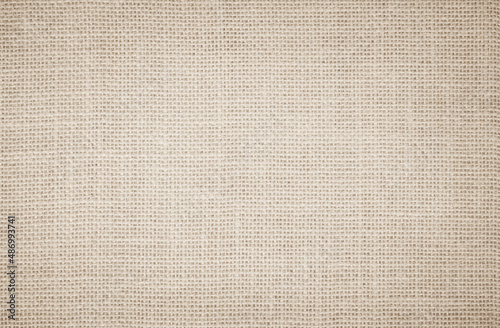 Jute hessian sackcloth burlap canvas woven texture background pattern in light beige cream brown color blank. Natural weaving fiber linen and cotton cloth 