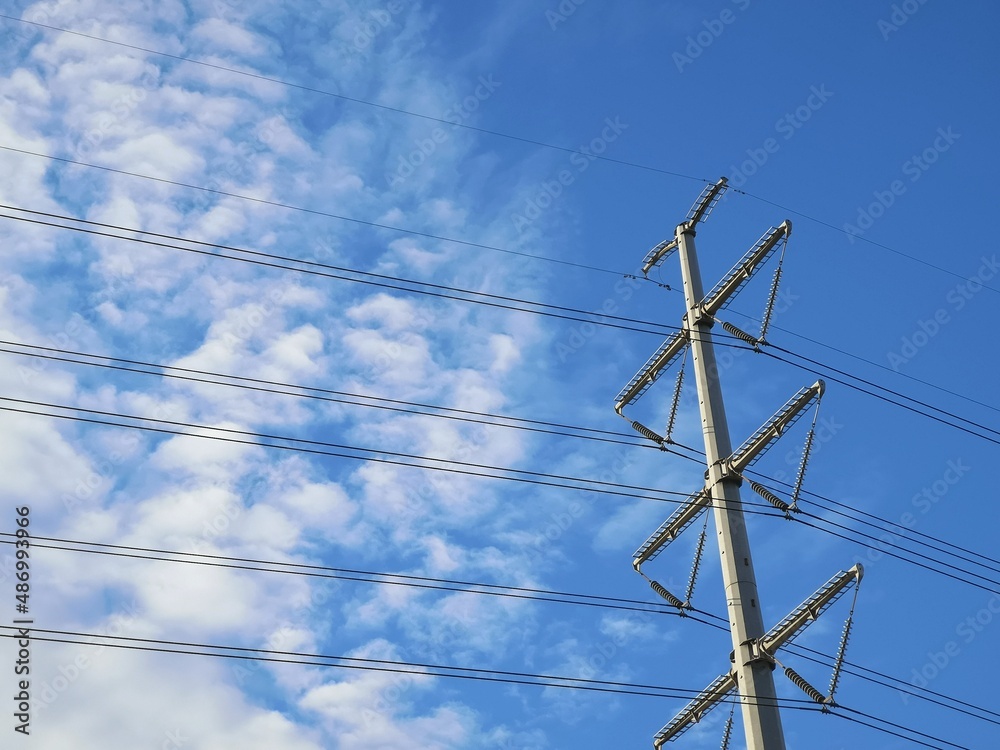 electricity tower with power lines and blue sky electricity tower with power lines and blue sky