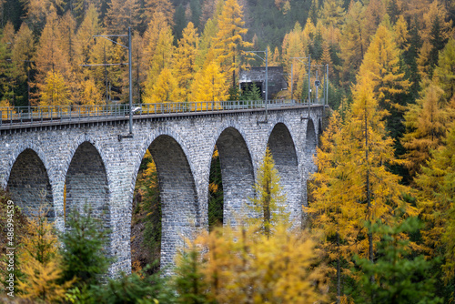 The Schmittentobel-Viadukt srrounded by yellowing trees in autumn in Switzerland photo