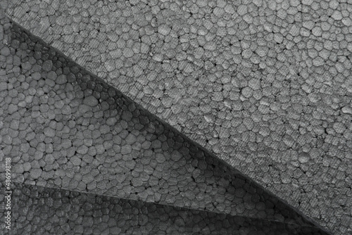 Photos Many grey styrofoam sheets as background, closeup