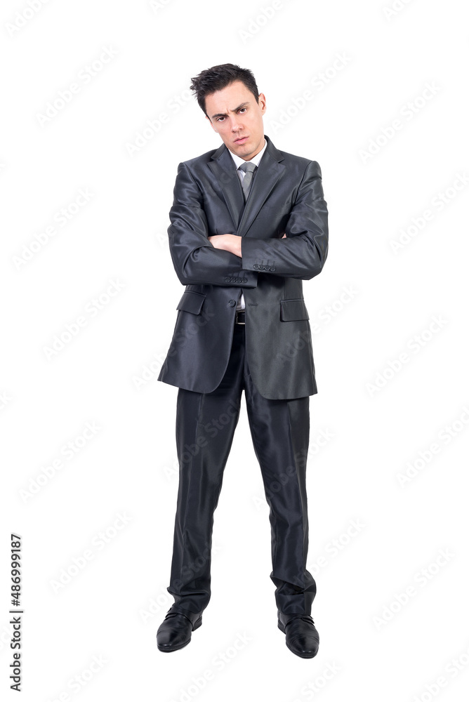 Bored elegant businessman with folded arms looking at camera Bored elegant businessman with folded arms looking at camera