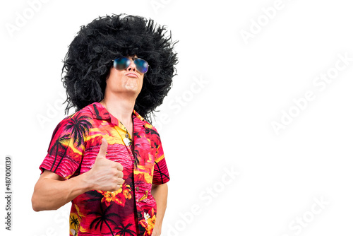 Proud man in funny Afro wig gesturing thumb up